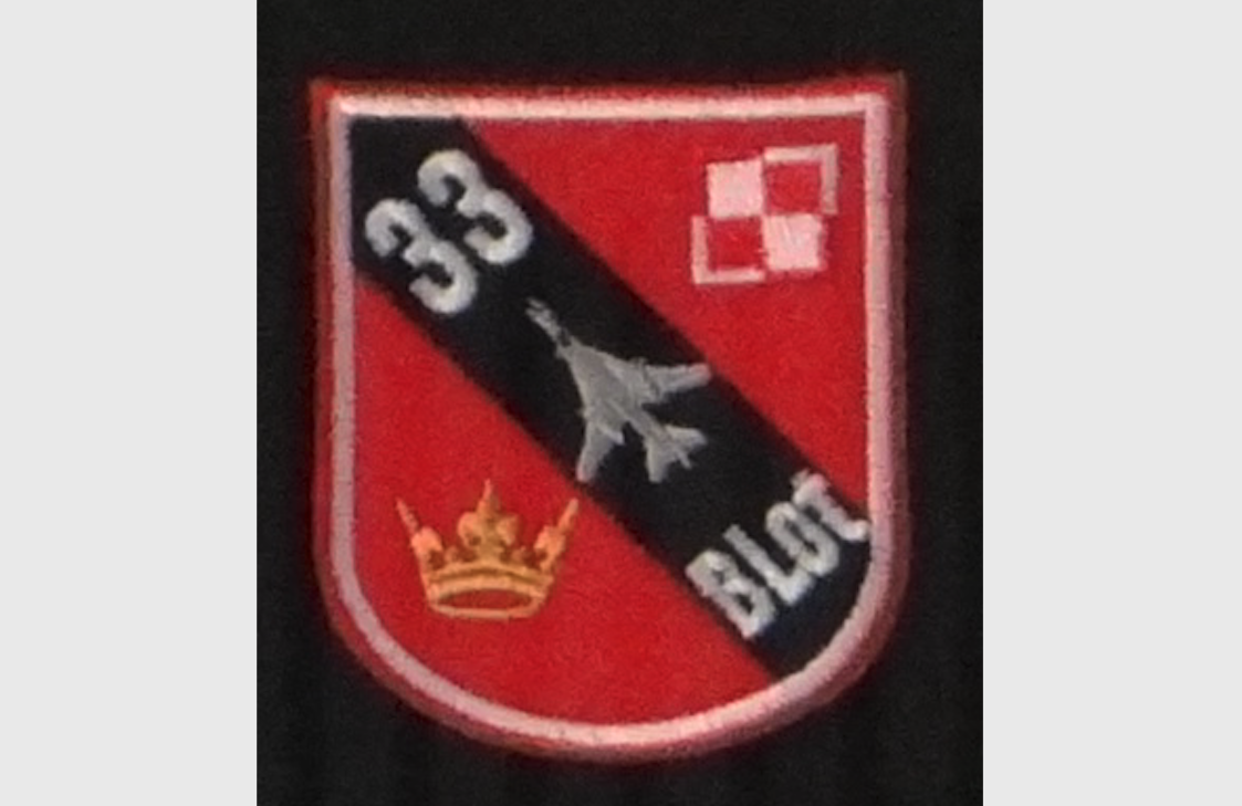 The emblem of the 33rd Air Base in Powidz