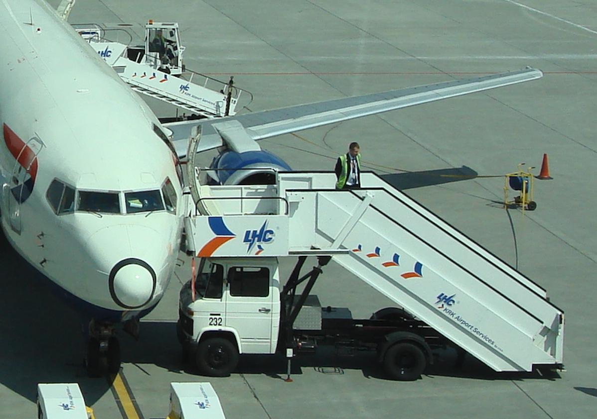 The gangway on a Mercedes chassis next to the Boeing B.737 plane. 2009 year. Photo by Karol Placha Hetman