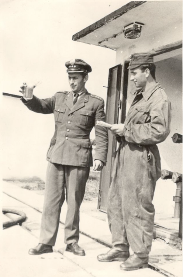 Behind the soldiers, a booth with connections for transferring fuel from a railway tank to the tanks of the MPS depot.