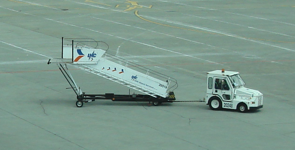 The gangway moved by an airport tug. 2009 year. Photo by Karol Placha Hetman